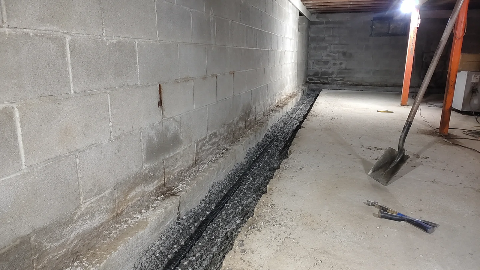 Interior Basement Waterproofing & Drainage Systems in progress in a Grand Rapids-area basement